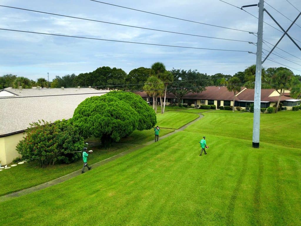 Landscape team maintaining large apartment landscape